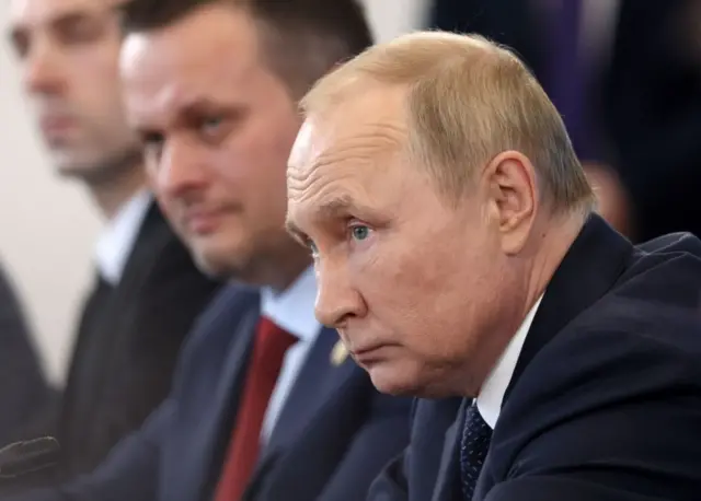 путін