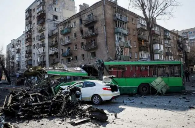 Missile debris destroyed a bus and set ablaze a residential building in the capital's Kurenivka district after being intercepted by Ukraine's air defences