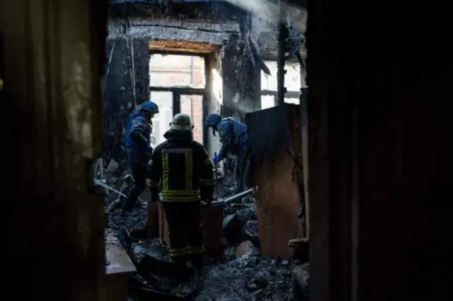First responders for building hit by a rocket attack for Kharkiv