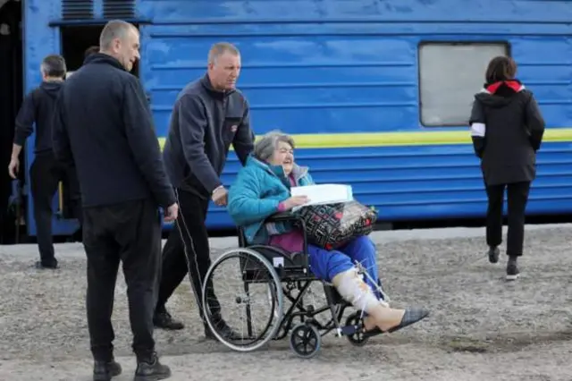 Medical workers assist evacuated and wounded people who arrived in Lviv from the cities of Bakhmut and Slovyansk