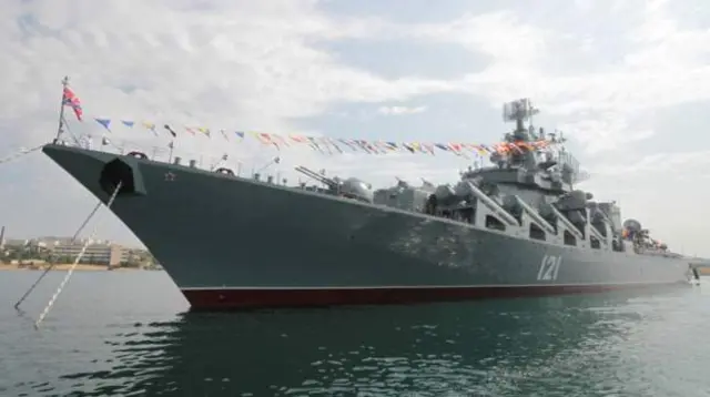 July 2017: Moored in the Crimean port Sevastopol, Moskva is decorated with bunting for a Navy Day parade