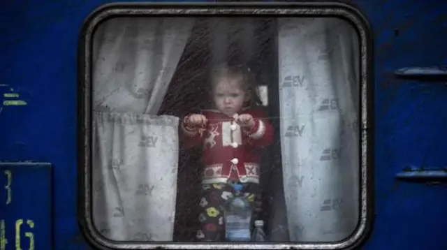 A child on a train at Kramatorsk central station as families flee the city in the Donbas regionImage caption: A child on a train at Kramatorsk central station as families flee the city in the Donbas region