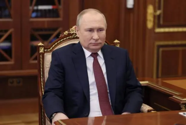 путін