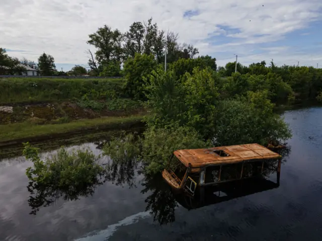 Bus inside river