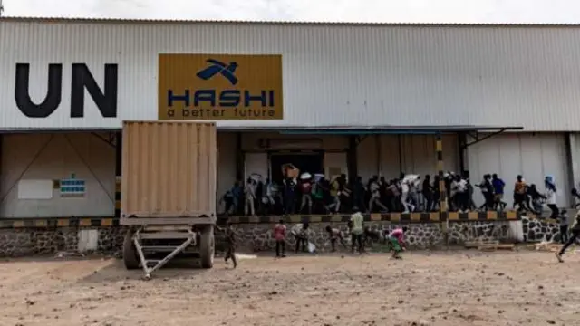 Protesters loot one UN warehouse on Monday...
