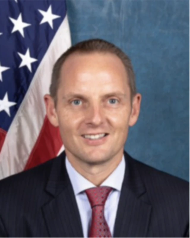 Chargé d’Affaires Eric Kneedler