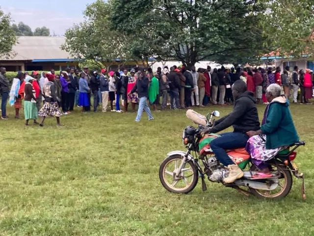 Okada man carri elderly woman go polling station