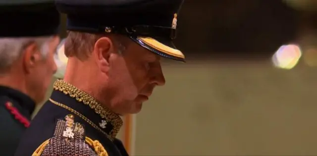 The Earl of Wessex, Prince Edward, stands beside his mother's coffin