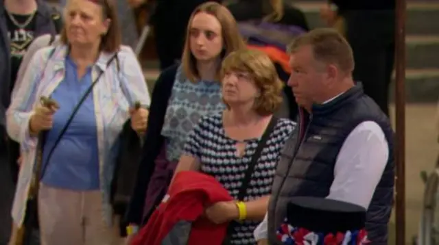 Some of the first through the Hall lined up at the head of the queue in the night
