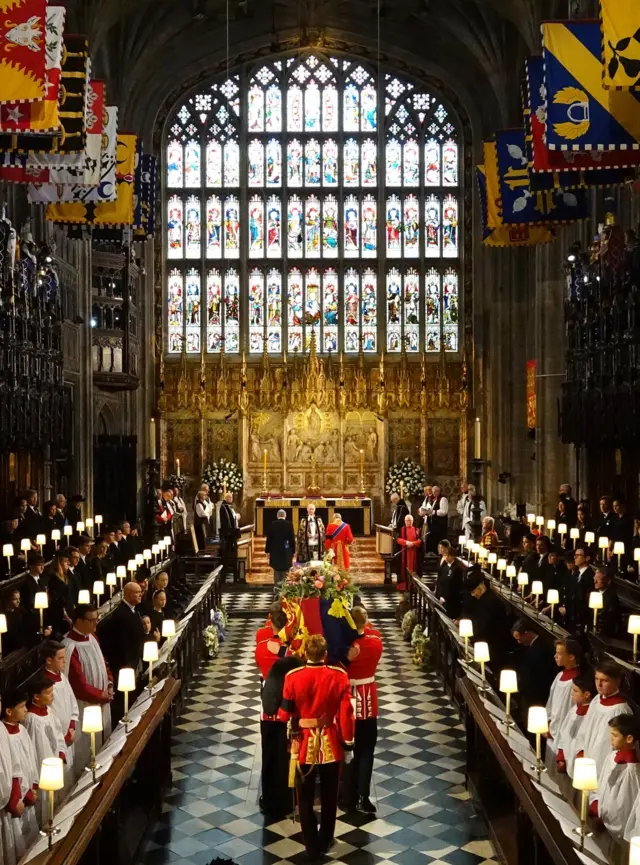The coffin of Queen Elizabeth II is carried into St George's Chapel in Windsor Castle