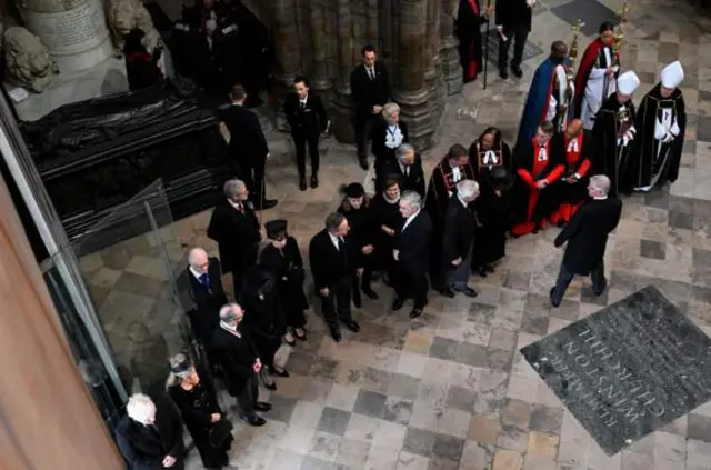 David Cameron, Gordon Brown and John Major being greeted as they enter the abbey