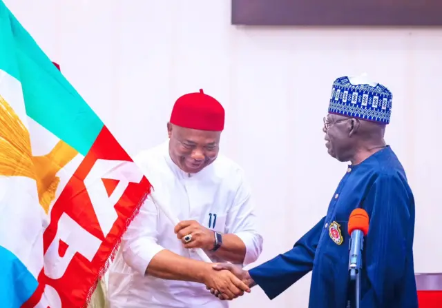 Hope Uzodinma shaking President Tinubu