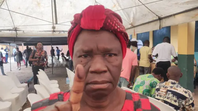 Woman show her finger wit ink