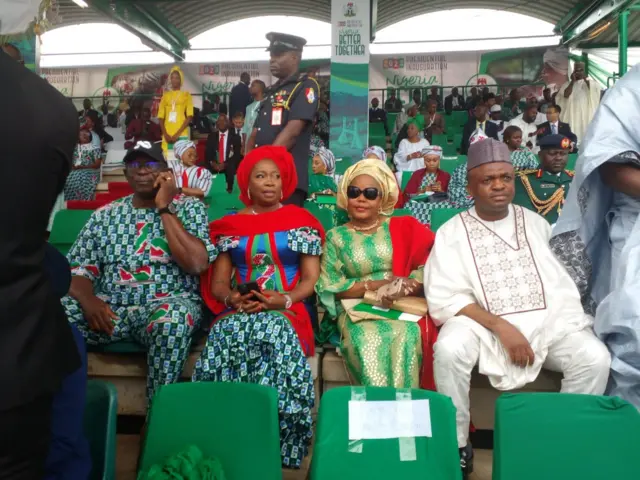 Dignitaries don begin show