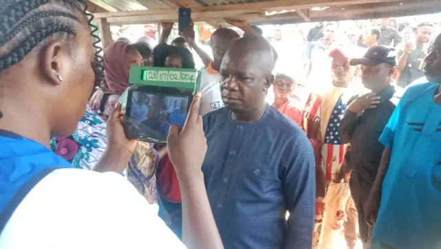 Man facing an accreditation machine