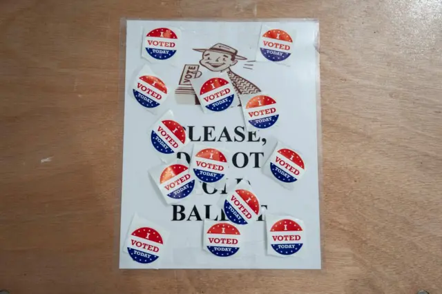 Stickers are seen in a voting tent on the day of the US presidential election