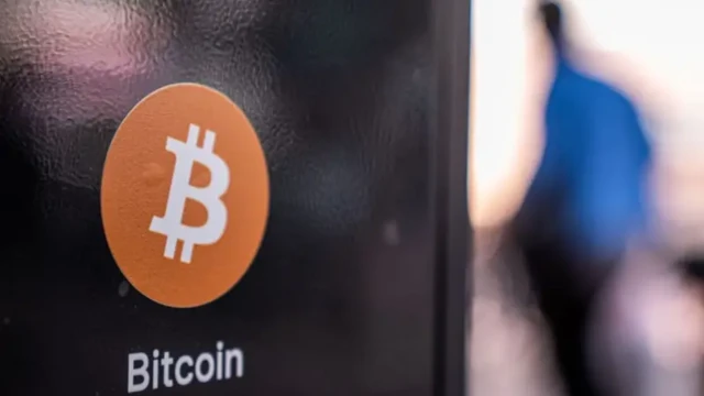 Signage for Bitcoin cryptocurrency on cryptocurrency ATM