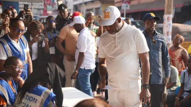 Dr Mathew Opoku Prempeh on white shirt