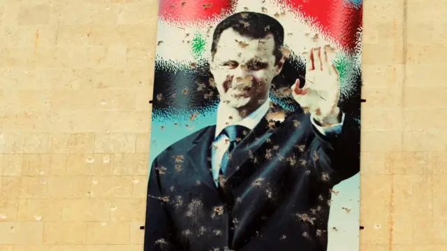 لوحة تحمل صورة الرئيس السوري بشار الأسد