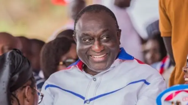 Alan John Kwadwo Kyerematen smiling while wearing white