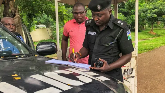 Police inspecting a car