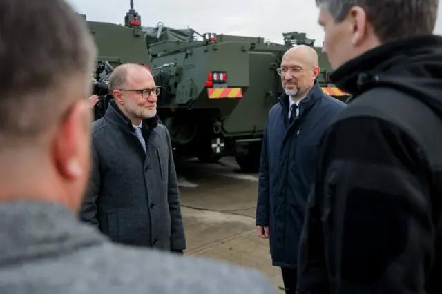 Денис Шмыгаль на фоне БТР в Латвии