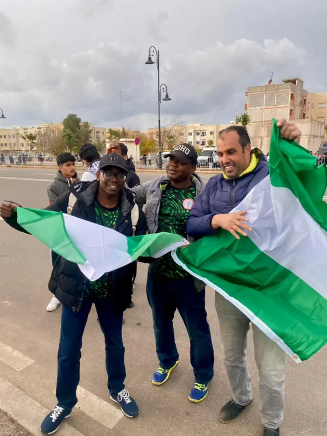 Fans holding Nigeria flag