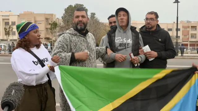 Fans holding Tanzania flag