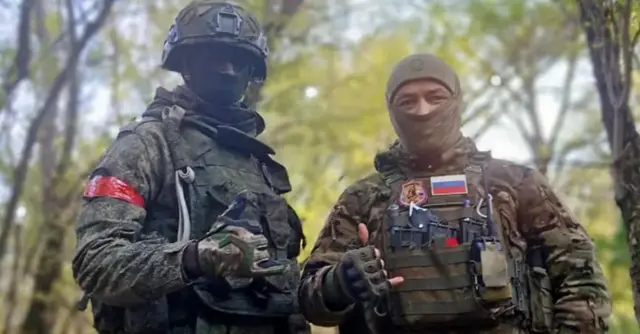 Дэвид Кулоба и российский военный