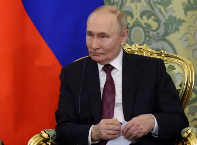 путін