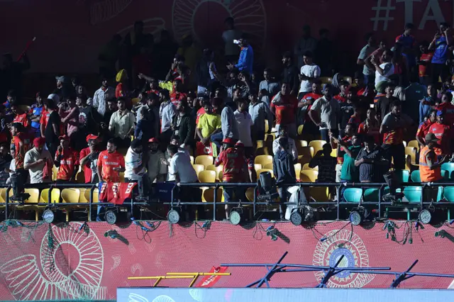 খেলা বন্ধ হওয়ার পর দর্শকরা ধরমশারার মাঠ ছেড়ে চলে যাচ্ছেন