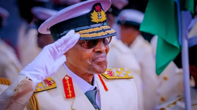 Buhari saluting in military uniform