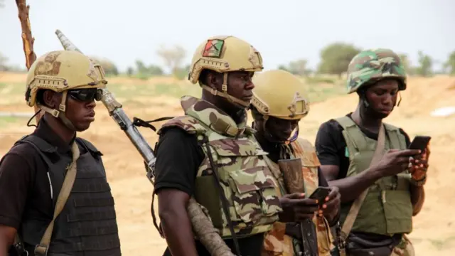 Nigerian Army soldiers stand at a base in Baga on August 2, 2019
