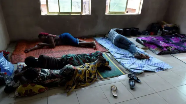 Lassa fever patients secondary contact and family members of Lassa fever victims lie on the floor at the Institute of Lassa Fever Research and Control in Irrua Specialist Teaching Hospital in Irrua, Edo State, midwest Nigeria, on March 6, 2018.