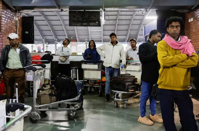 Stranded passengers wait at Tribhuvan International Airport after all evening flights to Sharjah, Doha, Dubai, Kuwait City, Abu Dhabi, and Dammam were cancelled, following strikes on Iran launched by the United States and Israel, in Kathmandu, Nepal, February 28, 2026. REUTERS/Navesh Chitrakar