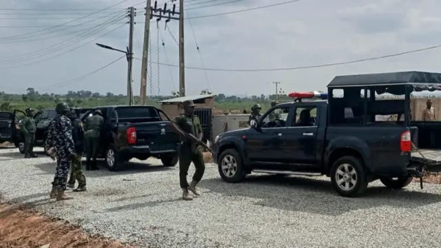 Security personnel stand at a female hostel at the Greenfield University in Kaduna, Nigeria, on April 21, 2021.