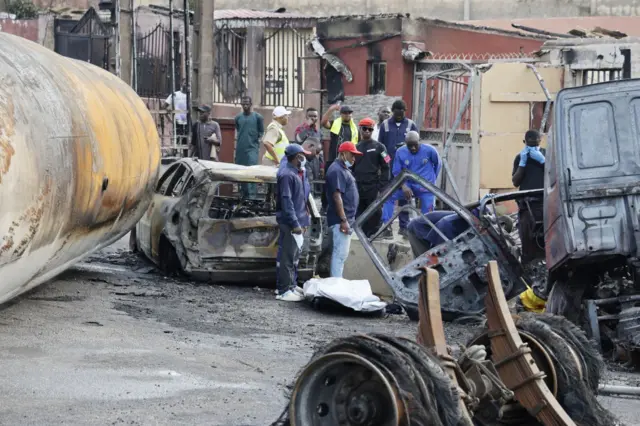 Teams work on the scene where a tanker carrying compressed natural gas (CNG) exploded and caused the death of 2 people and injured 14 other near Otedola Bridge in Lagos state
