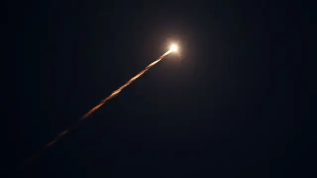 Israel's iron dome deence system is shown intercepting a projectile in this photo taken on Tuesday night