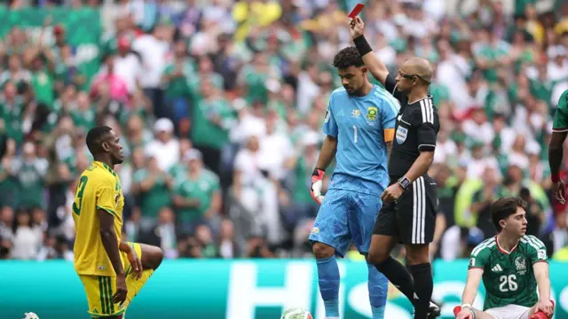 Referee Wilton Sampaio issues a red card to Sphephelo Sithole #13 of South Africa during the FIFA World Cup 2026 Group A match between Mexico and South Africa at Mexico City Stadium on June 11, 2026 in Mexico City, Mexico. (