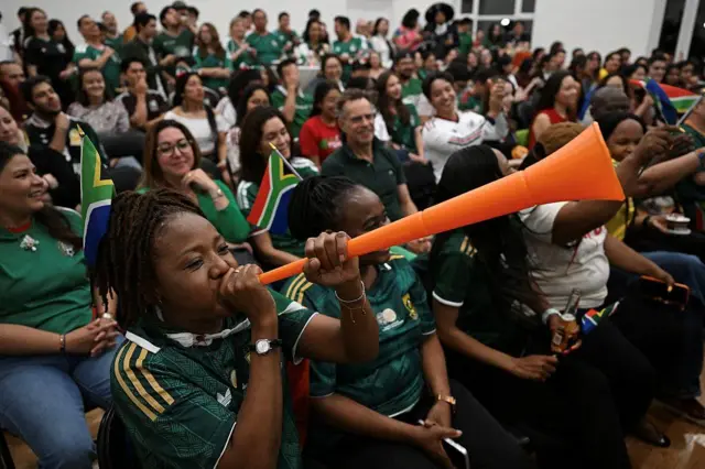 South Africa fan uses a vuvuzela