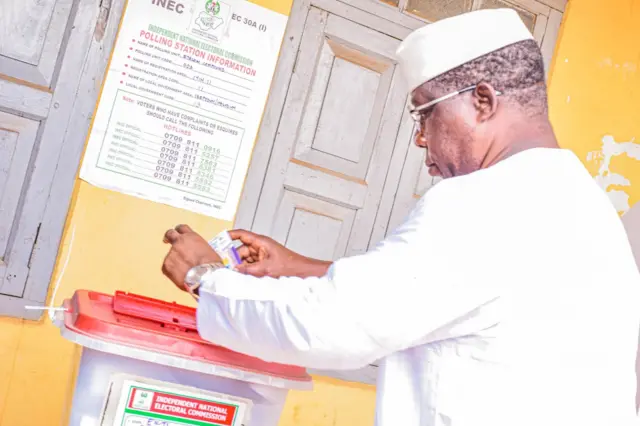 Man wearing white cast im ballot