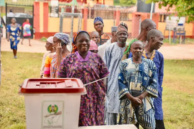 People queuing to vote
