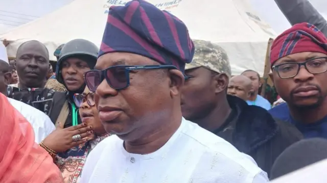 All Progressives Congress (APC) candidate, Bola Oyebamiji wear white cloth wit dark navy blue and pink stripe design cap