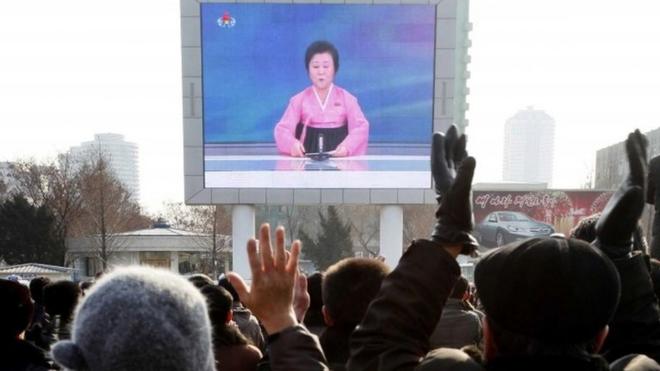 North Koreans watch the announcement, 6 Jan