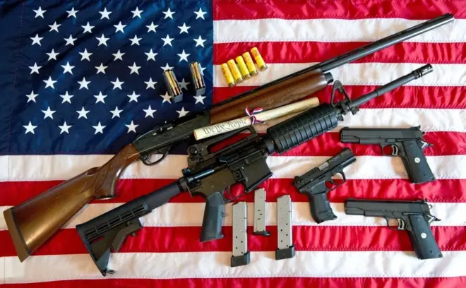 This February 4, 2013 photo illustration in Manassas, Virginia, shows a Remington 20-gauge semi-automatic shotgun, a Colt AR-15 semi-automatic rifle, a Colt .45 semi-auto handgun, a Walther PK380 semi-auto handgun and various ammunition clips with a copy of the US Constitution on top of the American flag. US President Barack Obama Monday heaped pressure on Congress for action "soon" on curbing gun violence. Obama made a pragmatic case for legislation on the contentious issue, arguing that just because political leaders could not save every life, they should at least try to save some victims of rampant gun crime.