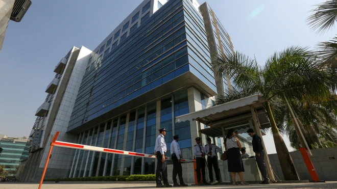 Security personnel stand guard outside the BBC's office in Mumbai