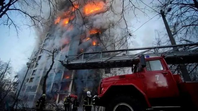 Firefighters battle a blaze in Kyiv