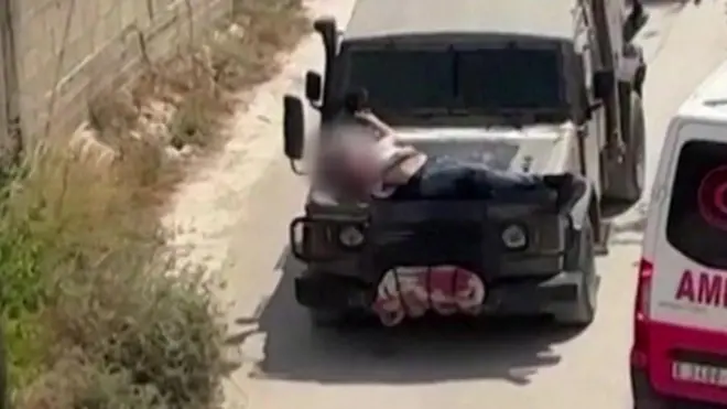 గాయపడిన వ్యక్తిని జీపుకు కట్టేసిన ఫోటో 