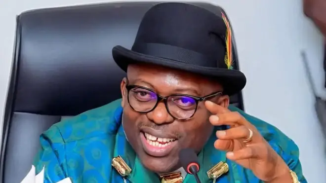 Govnor Siminalayi Fubara wear green shirt with coral bead and a black hat