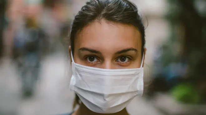 Woman wearing a surgical mask